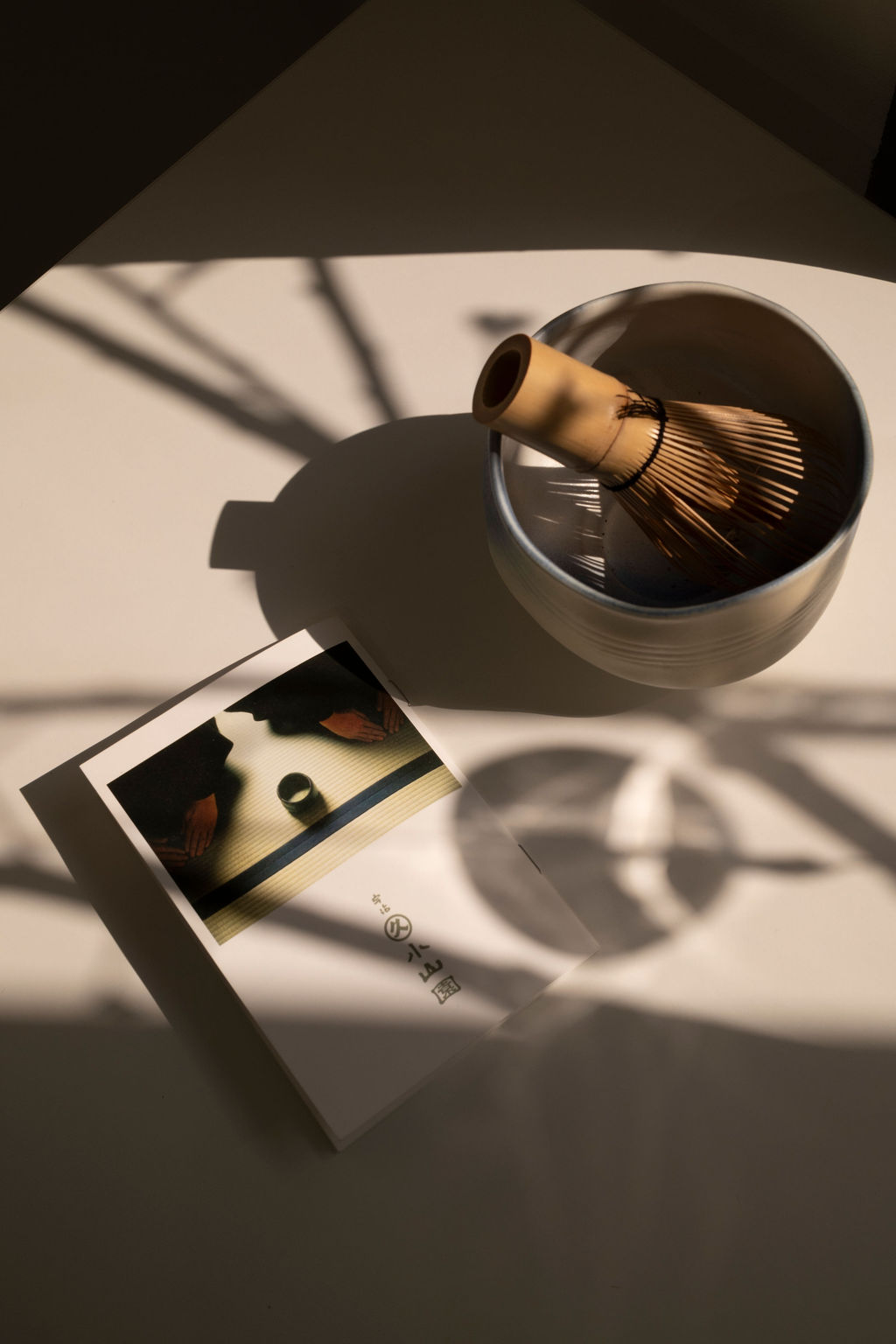 Whisking vivid green matcha in a ceremonial bowl